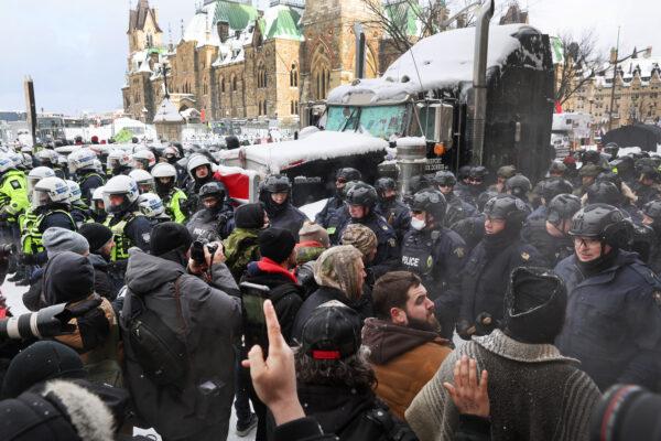 Police face off with demonstrators in Ottawa on Feb. 19, 2022. (Scott Olson/Getty Images)