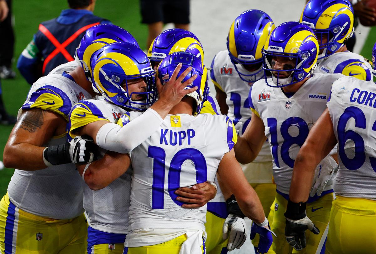 Cooper Kupp reacts with Matthew Stafford, number 9, following a touchdown reception during the fourth quarter of Super Bowl LVI against the Cincinnati Bengals at SoFi Stadium on Feb. 13, 2022, in Inglewood, California. (Ronald Martinez/Getty Images)