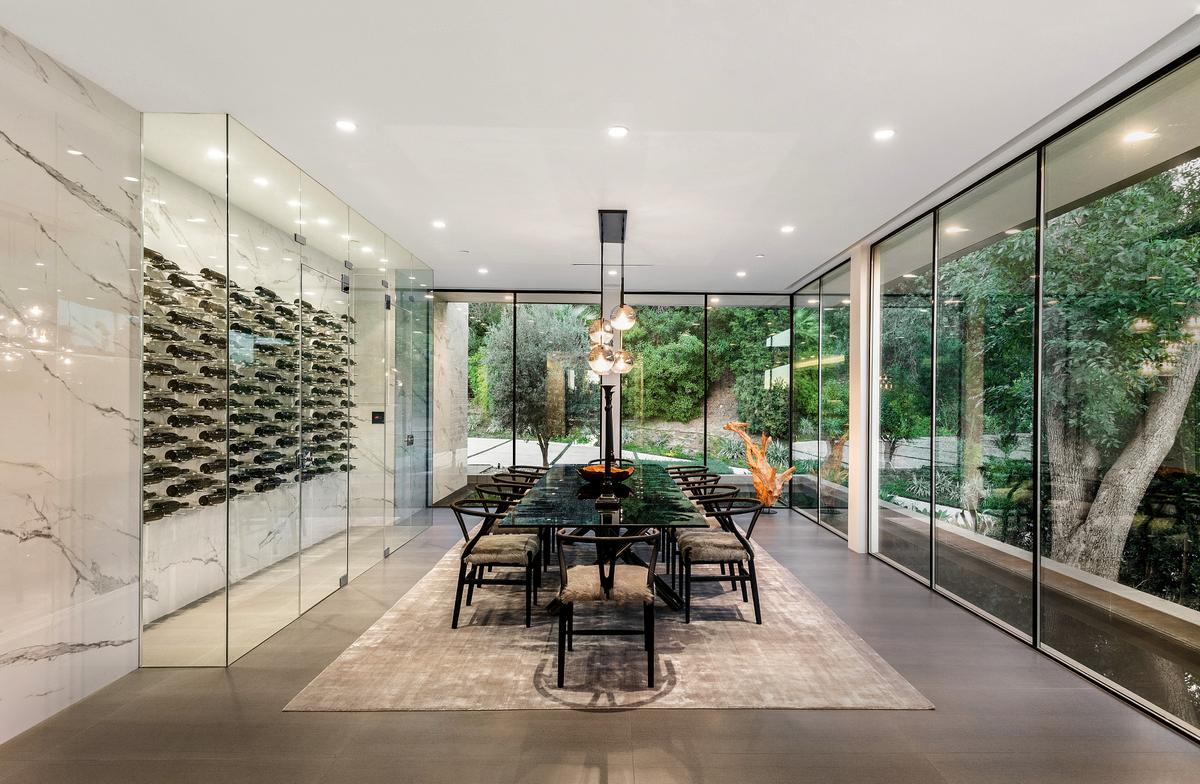 Mirahmadi also designed a “floating” dining room, which is surrounded by a moat. The room also has a temperature-controlled, glass-enclosed wine room for storing and displaying as many as 450 bottles. (Courtesy of Jade Mills Estates)