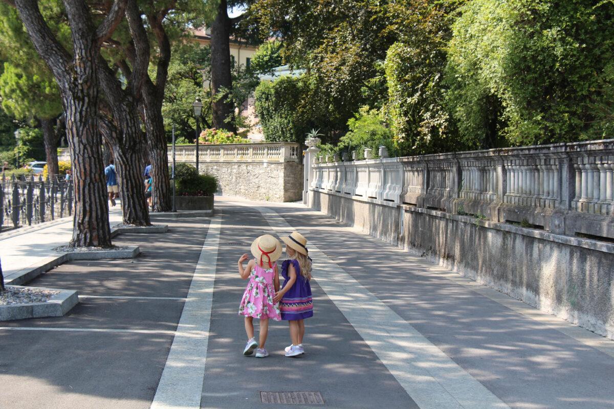 The author's twin 4-year-old granddaughters enjoy a stroll near Italy's Lake Como. (Giulia Longo)