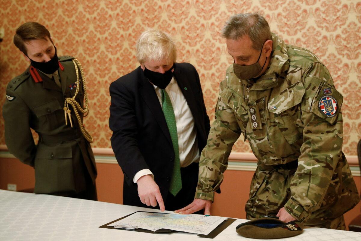  UK Prime Minister Boris Johnson attends a military briefing with Colonel James HF Thurstan, Commander of Operation Orbital, in Kyiv, Ukraine, on Feb. 1, 2022. (Peter Nicholls/PA)