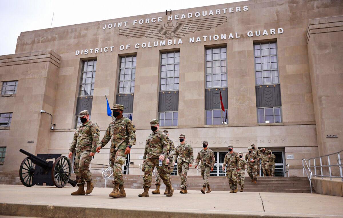 National Guard troops leave the Armory after ending their mission of providing security to the U.S. Capitol in Washington on May 24, 2021. (Kevin Dietsch/Getty Images)
