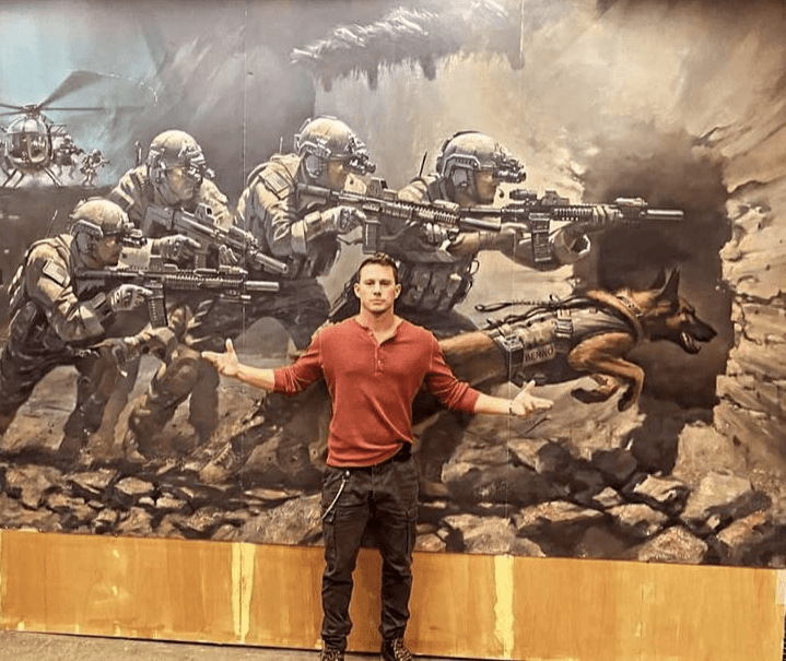 Channing Tatum poses in front of a war memorial painting for K-9's for "Dog." (Metro-Goldwyn-Mayer/United Artists Releasing)