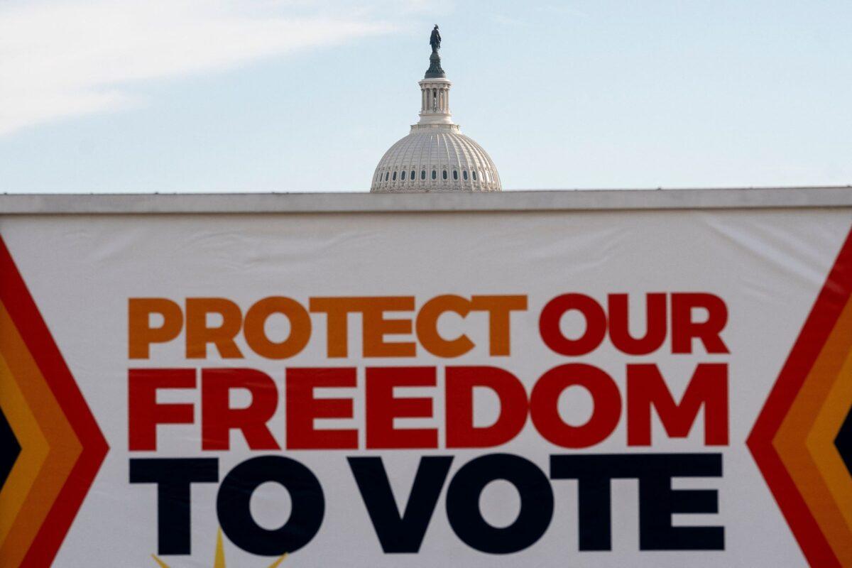 A vehicle displays a sign reading Protect Our Freedom To Vote in front of the U.S. Capitol in Washington on Jan. 19, 2022. (Stefani Reynolds/AFP via Getty Images)