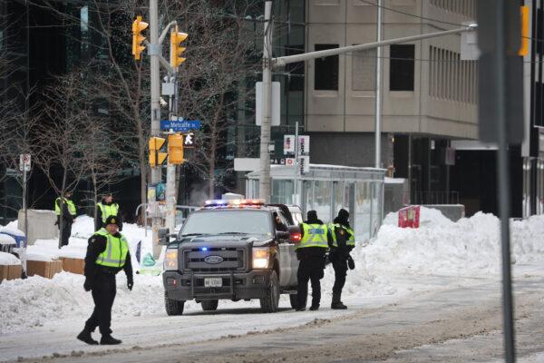 Police patrol the streets near Parliament Hill in Ottawa on Feb. 20, 2022. (Scott Olson/Getty Images)