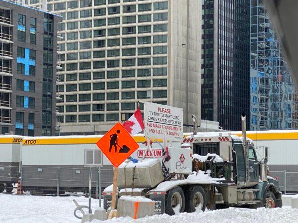 A truck with signs against COVID-19 mandates and restrictions in downtown Ottawa on Feb. 20, 2022. (Limin Zhou/The Epoch Times)