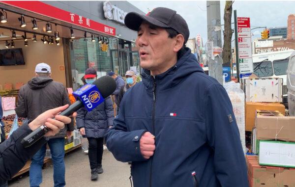 Guo Jinfu speaks to reporters in Flushing, New York, on Feb. 17, 2022. (Linda Lin/The Epoch Times)