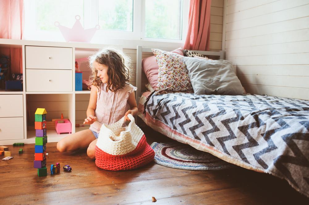 Whether you have kids, grandchildren, or nieces and nephews around the house, it's never too early to teach children how to organize. (Maria Evseyeva/Shutterstock)