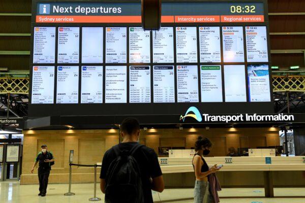 The main timetable screen is seen at Central Station after a union rail strike disrupted train services in Sydney, Australia, on Dec. 21, 2021. (AAP Image/Bianca De Marchi)