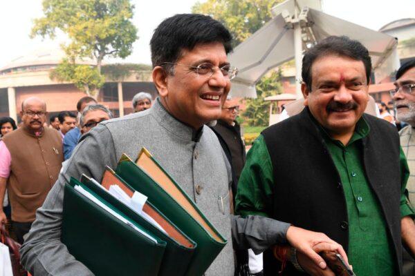 India's Minister of Railways Piyush Goyal (L) leaves after the Bharatiya Janata Party (BJP) parliamentary committee meeting at the Parliament House in New Delhi on Dec. 11, 2019. (Photo by Prakash Singh/ AFP via Getty Images)