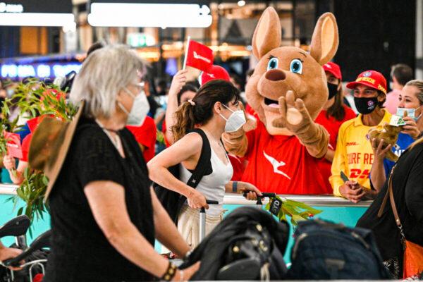 A mascot welcomes passengers upon arrival at the Sydney International Airport in Sydney, Australia, on Feb. 21, 2022. (Saeed Khan/AFP via Getty Images)