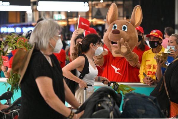 A Qantas mascot welcomes people upon arrival at the Sydney International Airport in Sydney, Australia, on February 21, 2022. (Saeed Khan/AFP via Getty Images)