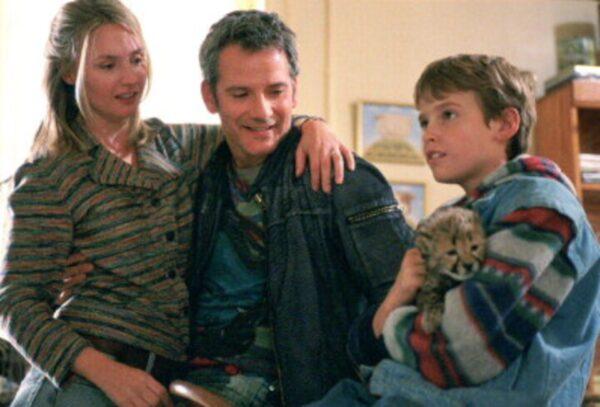 (L–R) Hope Davis, Campbell Scott, and Alexander Michaletos and Duma the cheetah in "Duma." (Warner Bros.)