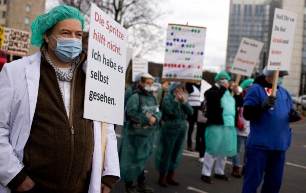 People gather during a protest against a mandate for health workers to get vaccinated against COVID-19 in Duesseldorf, Germany, on Feb. 19, 2022. (Max Brugger/Reuters)