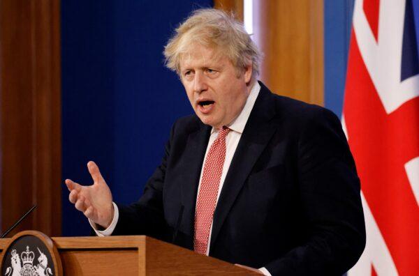 Britain's Prime Minister Boris Johnson answers questions during a press conference to outline the government's new long-term COVID-19 plan, inside the Downing Street Briefing Room in central London, on Feb. 21, 2022. (Tolga Akmen /AFP via Getty Images)