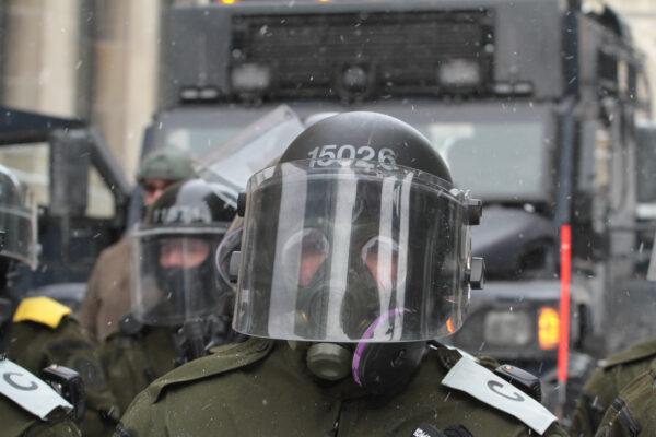 Canadian police halt protesters near Parliament Hill in Ottawa on Feb. 20, 2022. (Richard Moore/The Epoch Times)