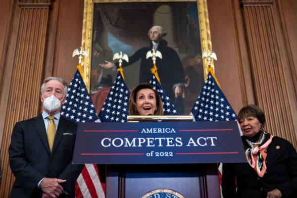 Flanked by Rep. Richard Neal (D-Mass.) and Rep. Eddie Bernice Johnson (D-Texas), Speaker of the House Nancy Pelosi speaks about the COMPETES Act at the U.S. Capitol on Feb. 4, 2022. (Drew Angerer/Getty Images)