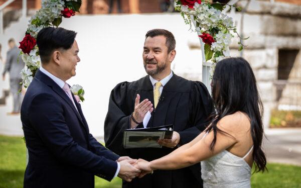 Orange County Clerk-Recorder Hugh Nguyen performs a wedding ceremony at Old Orange County Courthouse in Santa Ana, Calif., on Feb. 22, 2022.