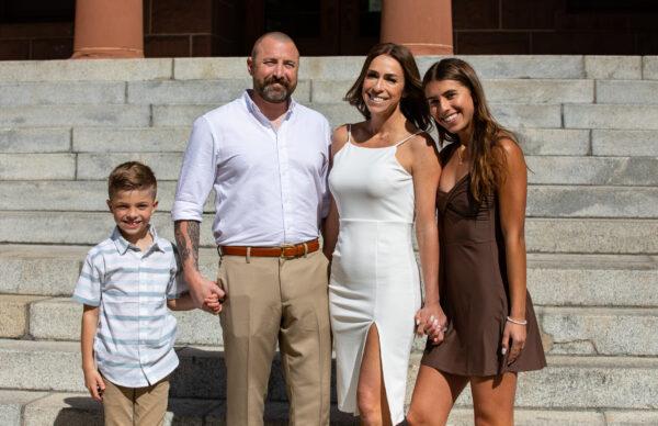 John and Brenda King stand with their children on the steps of the Old Orange County Courthouse after their marriage ceremony in Santa Ana, Calif., on Feb. 22, 2022.