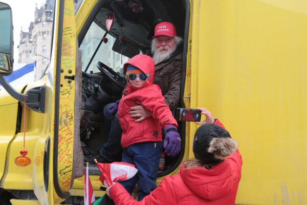 Mike Jamieson and visitor Rupert Jack in his truck at the Ottawa blockade on Feb. 16, 2022. (Richard Moore/The Epoch Times)