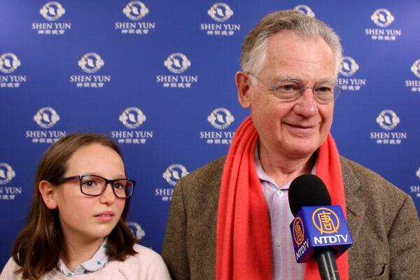 Professor François Bricaire and his granddaughter at Shen Yun Performing Arts in Paris on Jan. 15, 2022. (NTD)