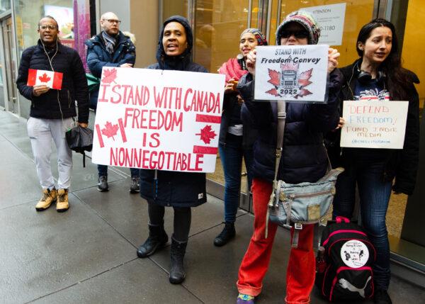 New Yorkers rally in solidarity of the Canadian truckers outside the Canadian Consulate’s building in midtown Manhattan on Feb. 22, 2022. (Dave Paone/The Epoch Times)