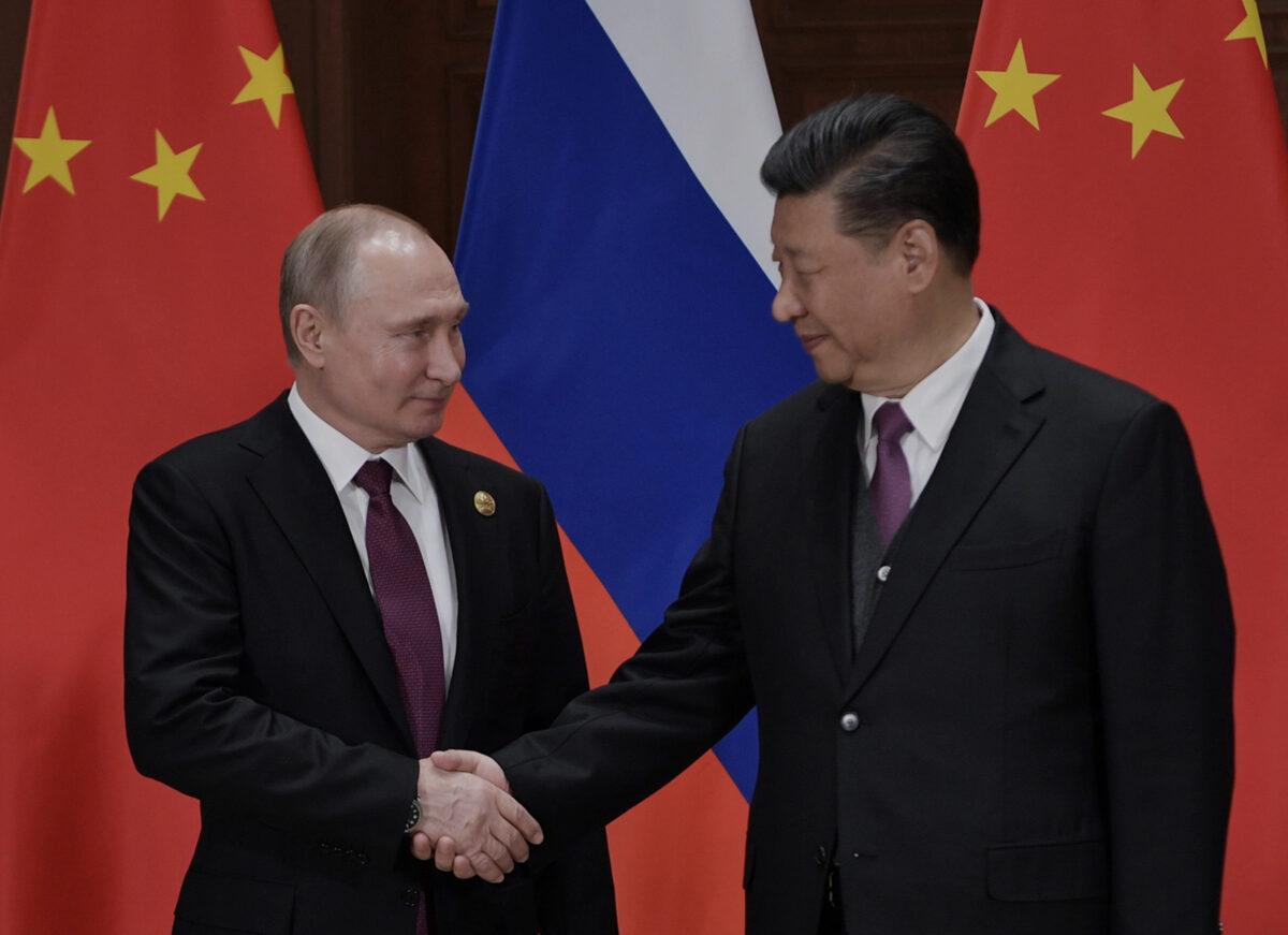 Russia's President Vladimir Putin shakes hands with China's leader Xi Jinping during their meeting at Friendship Palace in Beijing, China on April 26, 2019. (Alexey Nikolsky/AFP via Getty Images)