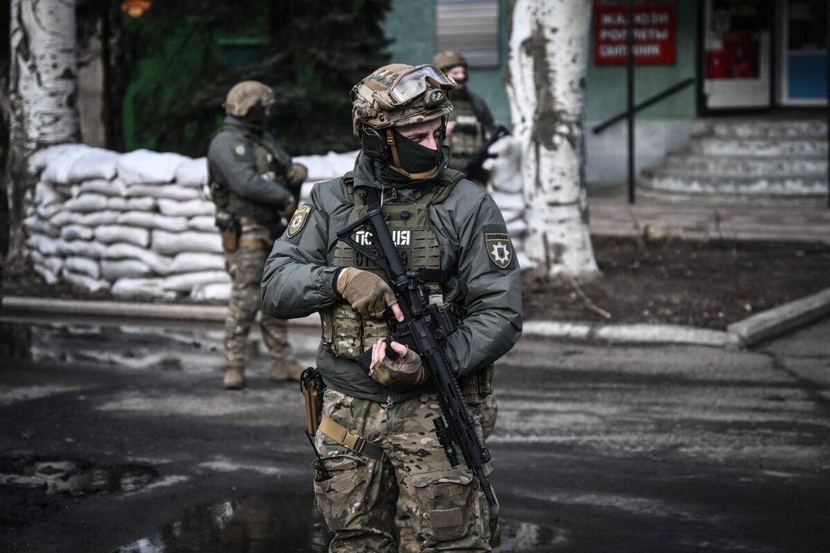 Ukrainian troops patrol in the town of Novoluhanske, Ukraine, on Feb. 19, 2022. (Aris Messinis/AFP via Getty Images)