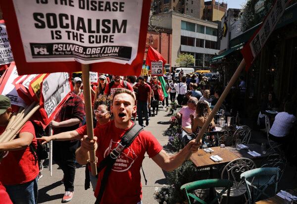 Dozens of people march in May Day protests on May 1, 2018, in New York City. (Spencer Platt/Getty Images)