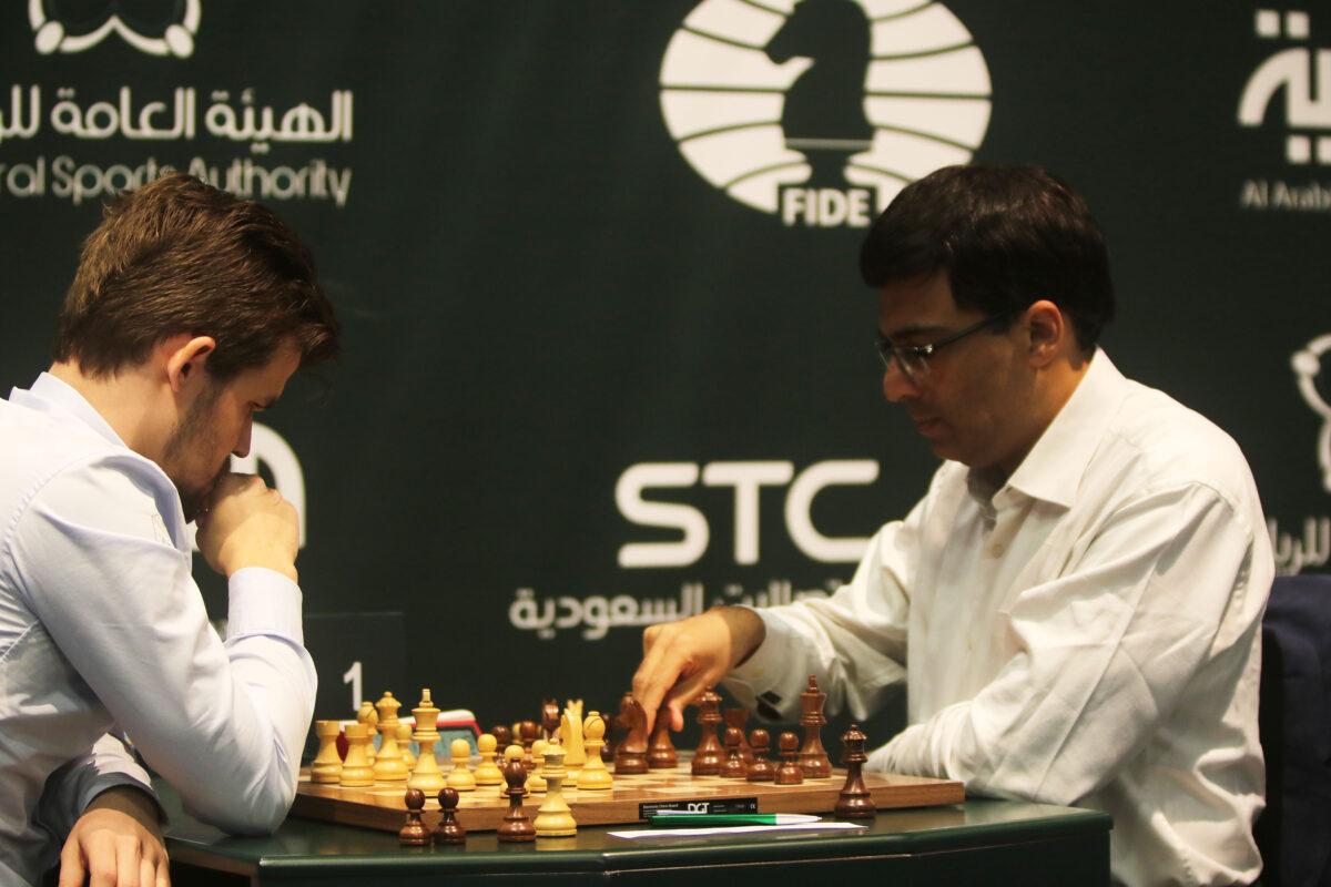 Magnus Carlsen (L) and Anand Viswanathan (R) compete on day 3 of the King Salman Rapid & Blitz Chess Championships in Riyadh, Saudi Arabia on Dec. 27, 2017. (Salah Malkawi/ Getty Images)