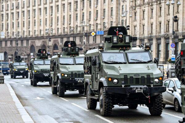 Ukrainian military vehicles move past Independence square in central Kyiv, Ukraine, on Feb. 24, 2022. (Daniel Leal/AFP via Getty Images)