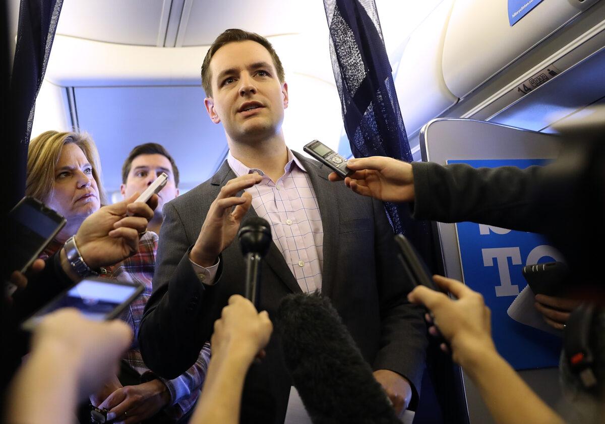 Robby Mook, campaign manager for Democratic presidential nominee and former Secretary of State Hillary Clinton, speaks aboard the campaign plane while traveling to Cedar Rapids, Iowa, on Oct. 28, 2016. (Justin Sullivan/Getty Images)