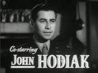 John Hodiak co-stars in "Two Smart People." (Public Domain)