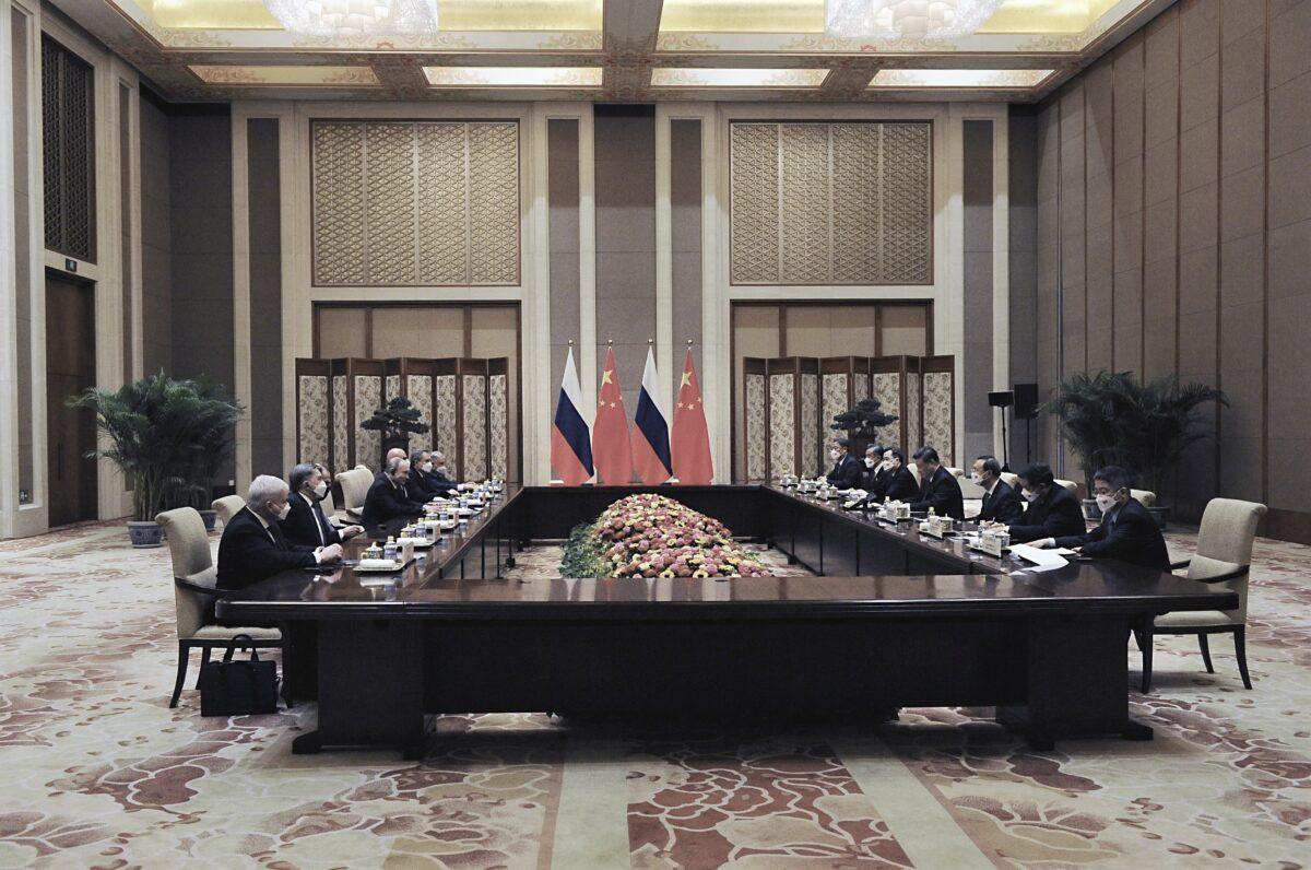 Russian President Vladimir Putin (C-L) meets with Chinese leader Xi Jinping in Beijing on Feb. 4, 2022. (Alexei Druzhinin/Sputnik/AFP via Getty Images)