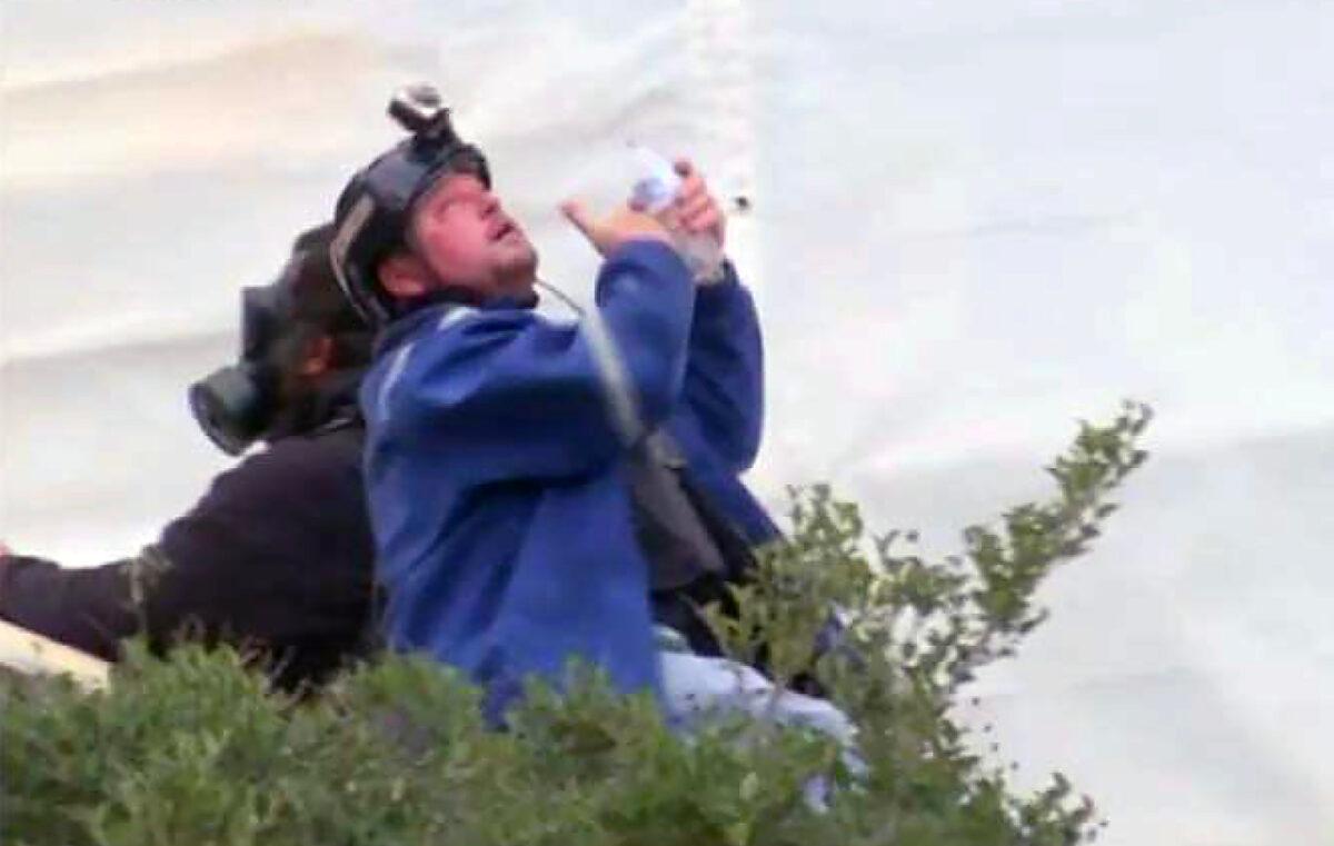 Guy Wesley Reffitt rinses his eyes after police doused him with pepper spray at the U.S. Capitol on Jan. 6, 2021. (U.S. Department of Justice via The Epoch Times)