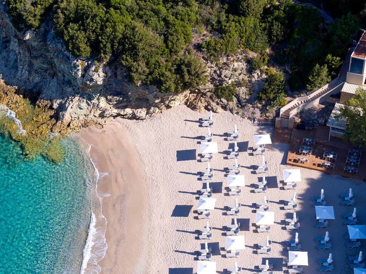 The beautiful beach of Karavostasi stretches out below Marbella Elix. (Courtesy of Marbella Elix)