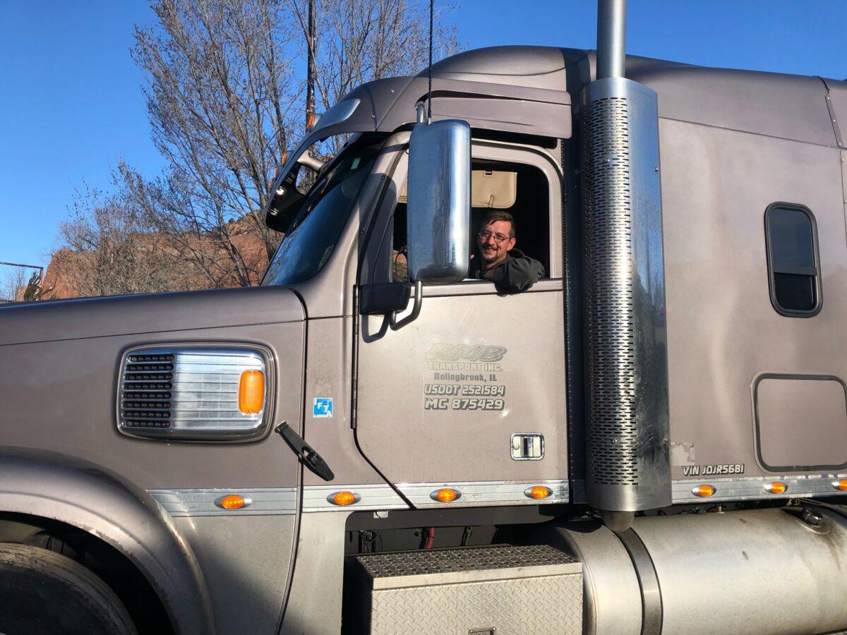 Aaron Hovis, part of the People's Convoy, in his truck in Lupton, Ariz., on Feb. 24, 2022. (Enrico Trigoso/The Epoch Times)