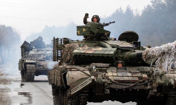 Ukrainian servicemen ride on tanks towards the front line with Russian forces in the Lugansk region of Ukraine on Feb. 25, 2022. (Anatolii Stepanov/AFP via Getty Images)
