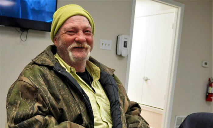 Homeless double amputee Donald Merrick lost his feet and lower legs to frostbite. He said "staying warm" was all he cared about in Tyler on Feb. 24, 2022. (Patrick Butler/The Epoch Times)