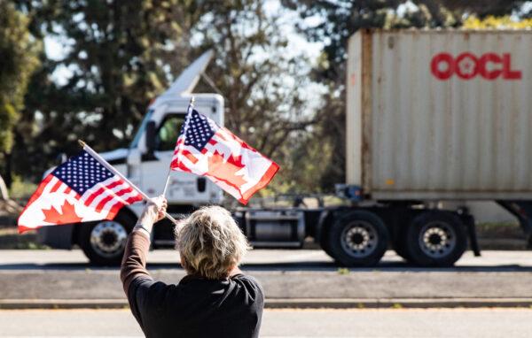 People gather in El Monte, Calif., to show support for truckers partaking in a convoy from Los Angeles to Washington, D.C in protest of coronavirus mandates on Feb. 25, 2022. (John Fredricks/The Epoch Times)