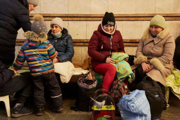 People take shelter from bombs in an underground station in Kyiv, Ukraine, on Feb. 25, 2022. (Sergei Supinsky/AFP via Getty Images)