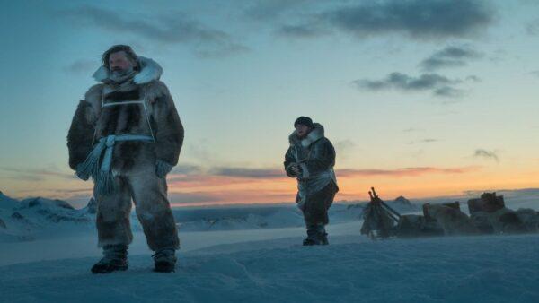 Nikolaj Coster-Waldau as Mikkelsen and Joe Cole as Iver Iversen in “Against the Ice.” (Netflix)