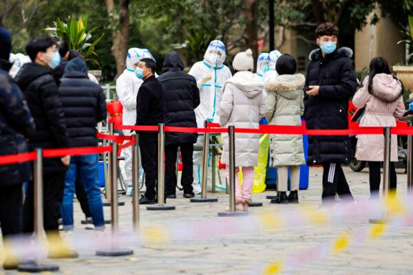 Residents queue to undergo a nasal swab for COVID-19 testing in Suzhou, China, on Feb. 16, 2022. (STR/AFP via Getty Images)