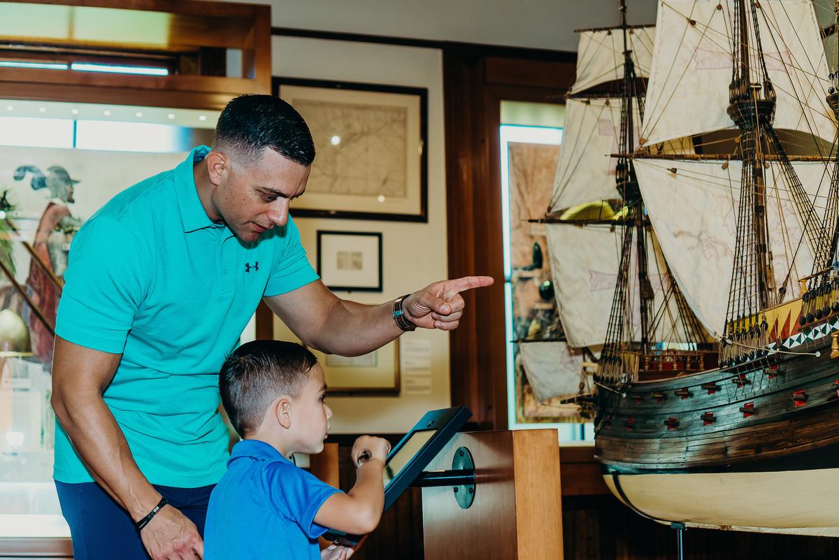 A father and son enjoy the features of the Bryan Museum. (Visit Galveston)