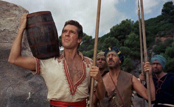 Sinbad (Kerwin Mathews) and his crew look for supplies on the island of Colossa. (Columbia Pictures)