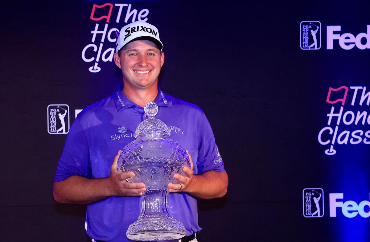 Sepp Straka of Austria poseswith the trophy during a press conference after putting in to win on the 18th green during the final round of The Honda Classic at PGA National Resort And Spa, in Palm Beach Gardens, Florida, on February 27, 2022. (Mike Ehrmann/Getty Images)