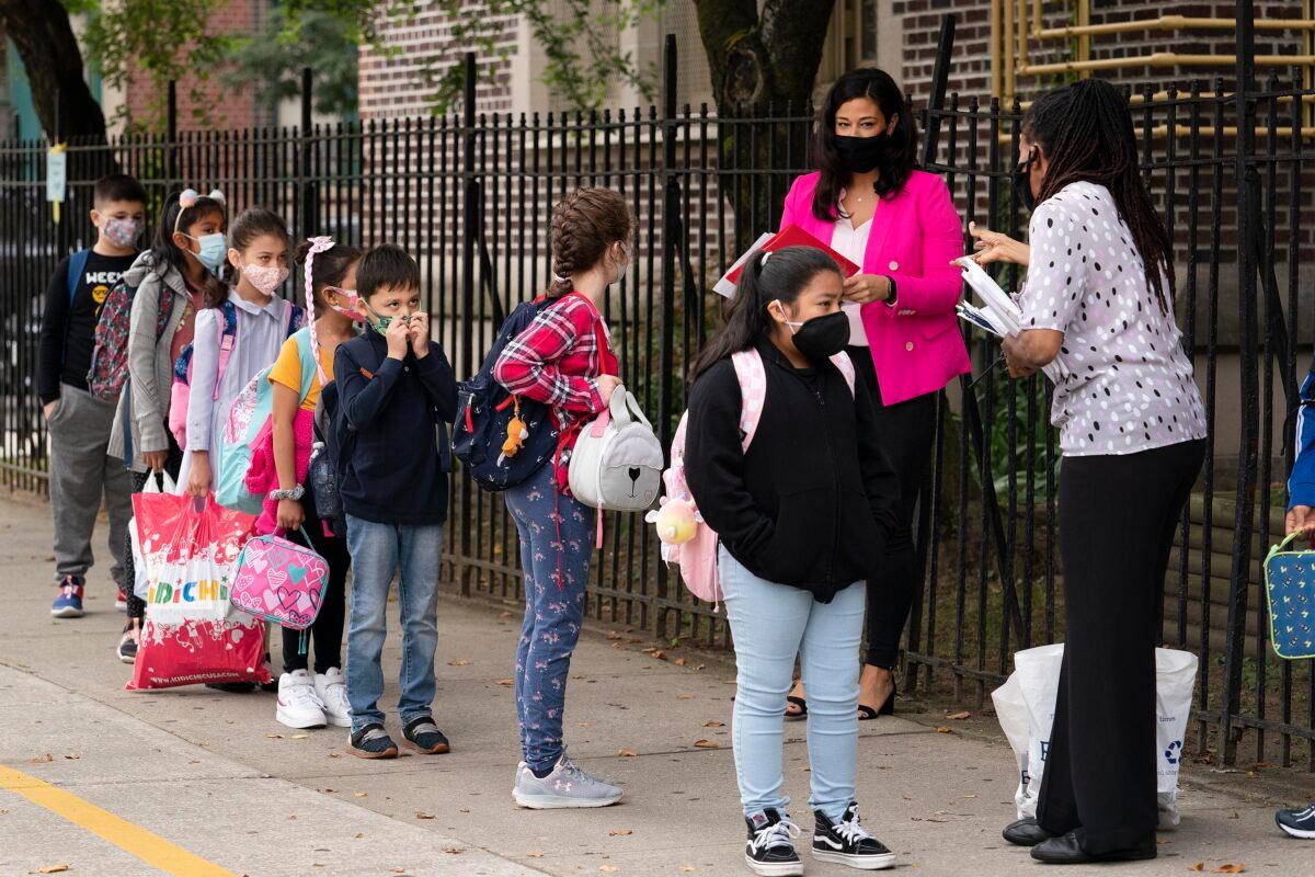Teachers line up their students before entering P.S. 179 elementary school in New York in a file image. (Mark Lennihan/AP Photo)