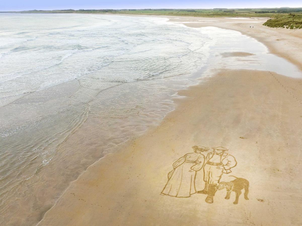 A retired general practitioner has re-created a famous masterpiece of a devoted couple looking out to sea—as a giant drawing on her favorite beach using a garden rake. (SWNS)