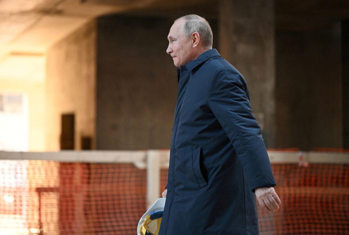 Russian President Vladimir Putin walks in Moscow, Russia on Feb. 27, 2022. (Sputnik/Sergey Guneev/Kremlin via Reuters)