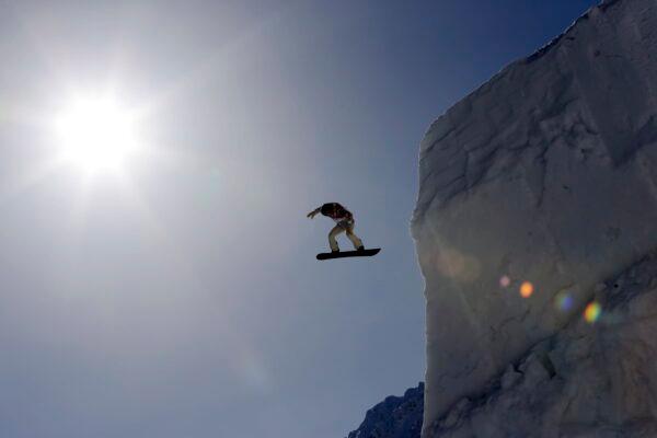 Shaun White of the United States takes a jump during a snowboard slopestyle training session at the Rosa Khutor Extreme Park, prior to the 2014 Winter Olympics, in Krasnaya Polyana, Russia, on Feb. 4, 2014. (Andy Wong/AP Photo)